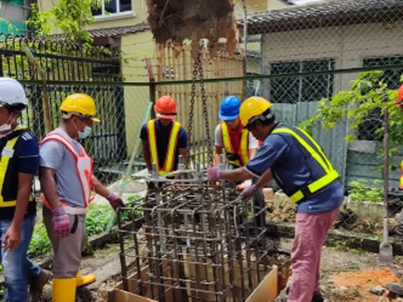 Crew building a tower foundation